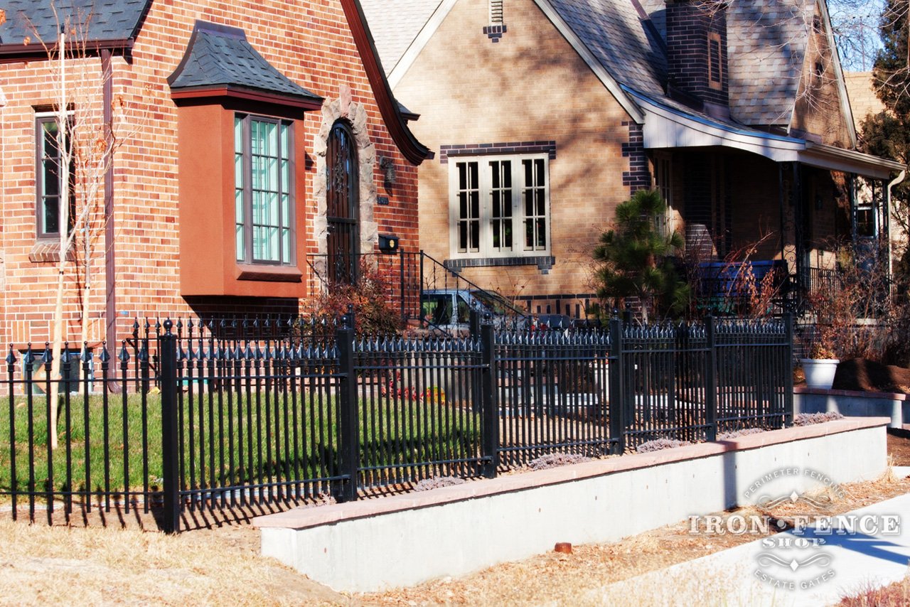 3ft Tall Signature Grade Iron Fence Panel Installed Behind a Retaining Wall (Style #1: Classic)