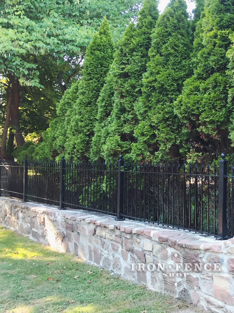 3ft Tall Iron Fence Installed on a Stone Wall with Flange Posts
