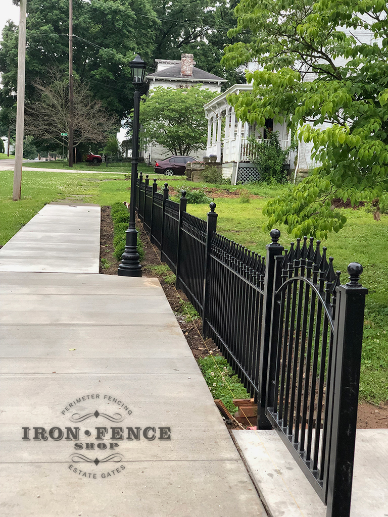 Our 3ft Signature Classic Iron Fence Stair-Stepped to a 4ft Wide Arch Gate