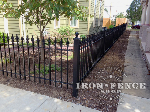 3ft Tall Wrought Iron Fence in Classic Style and Signature Grade used Along a Corner Sidewalk