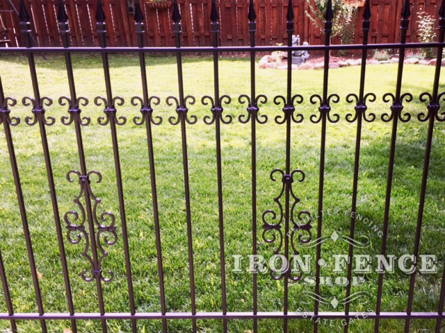 Guardian and Butterfly Add-on Decorations Added to a Traditional Grade Iron Fence Panel