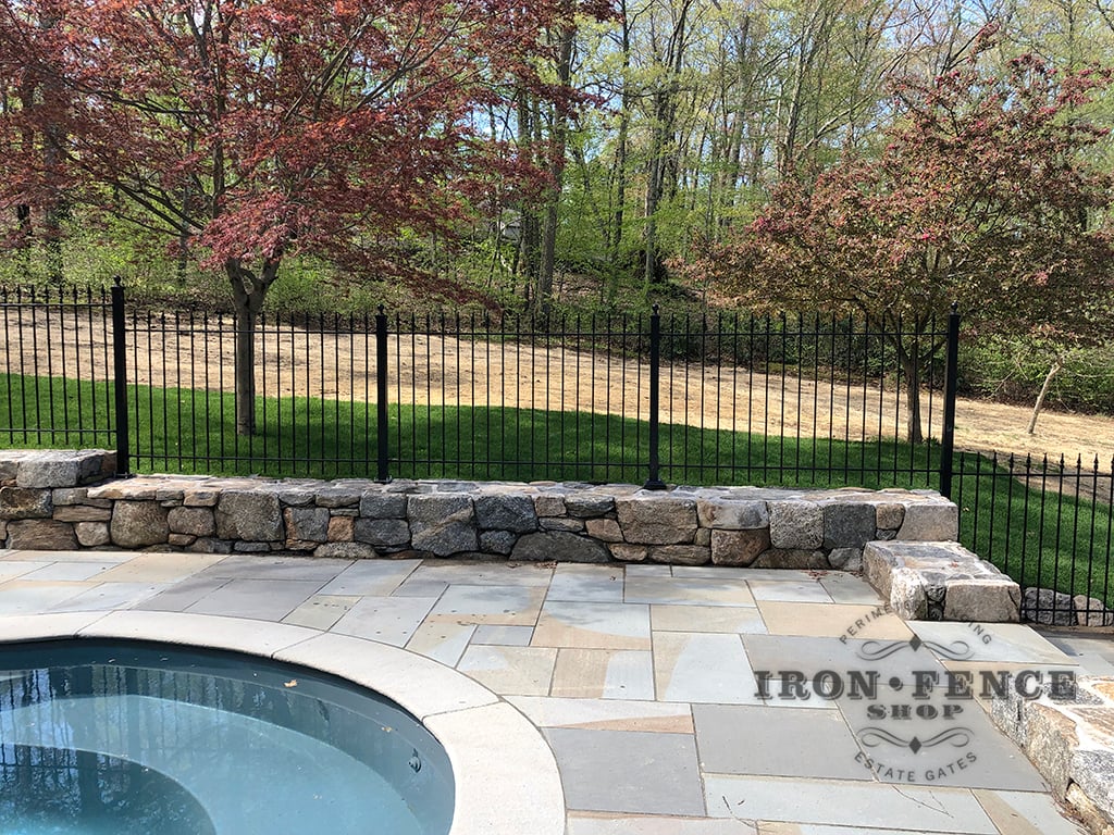 4ft Tall Classic Iron Fence Installed on a Wall Top Surrounding a Pool