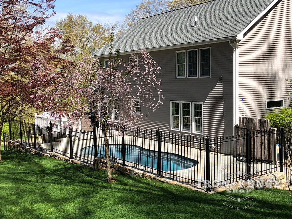 4ft Tall Traditional Grade Classic Wrought Iron Fence Installed on a Stone Wall