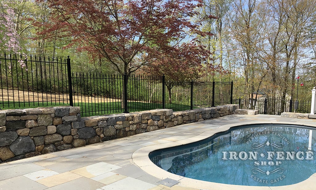 4ft Tall Wrought Iron Fence in Classic Style Stepped Down a Stone Wall