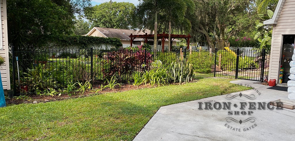 5ft Tall Classic Style Stronghold Iron Fence in a Garden Setting