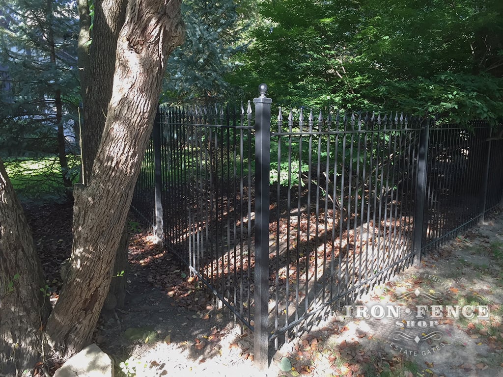 Our 5ft Tall Classic Iron Fence Installed on a Wooded Lot
