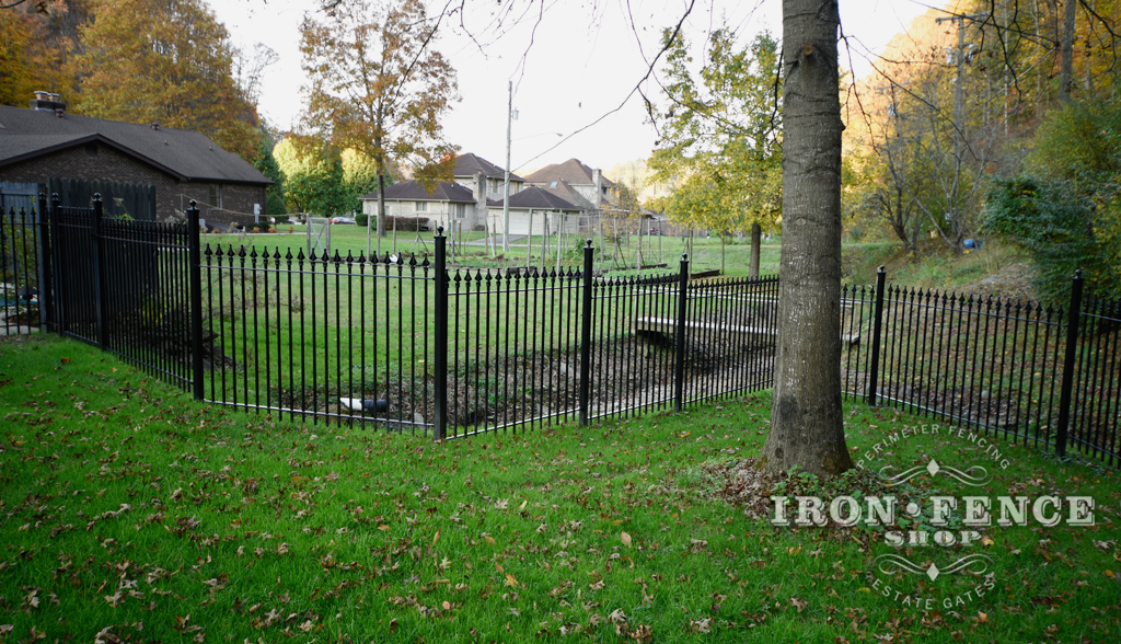 Wrought Iron Fence Stepped to Accommodate A Sloped Hill in the Yard