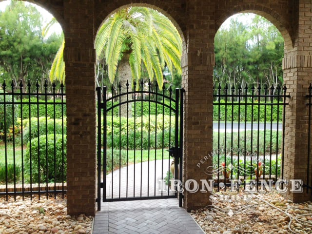 6ft Tall Wrought Iron Arched Gate and Fence Installed in a Brick Archway (Signature Grade)