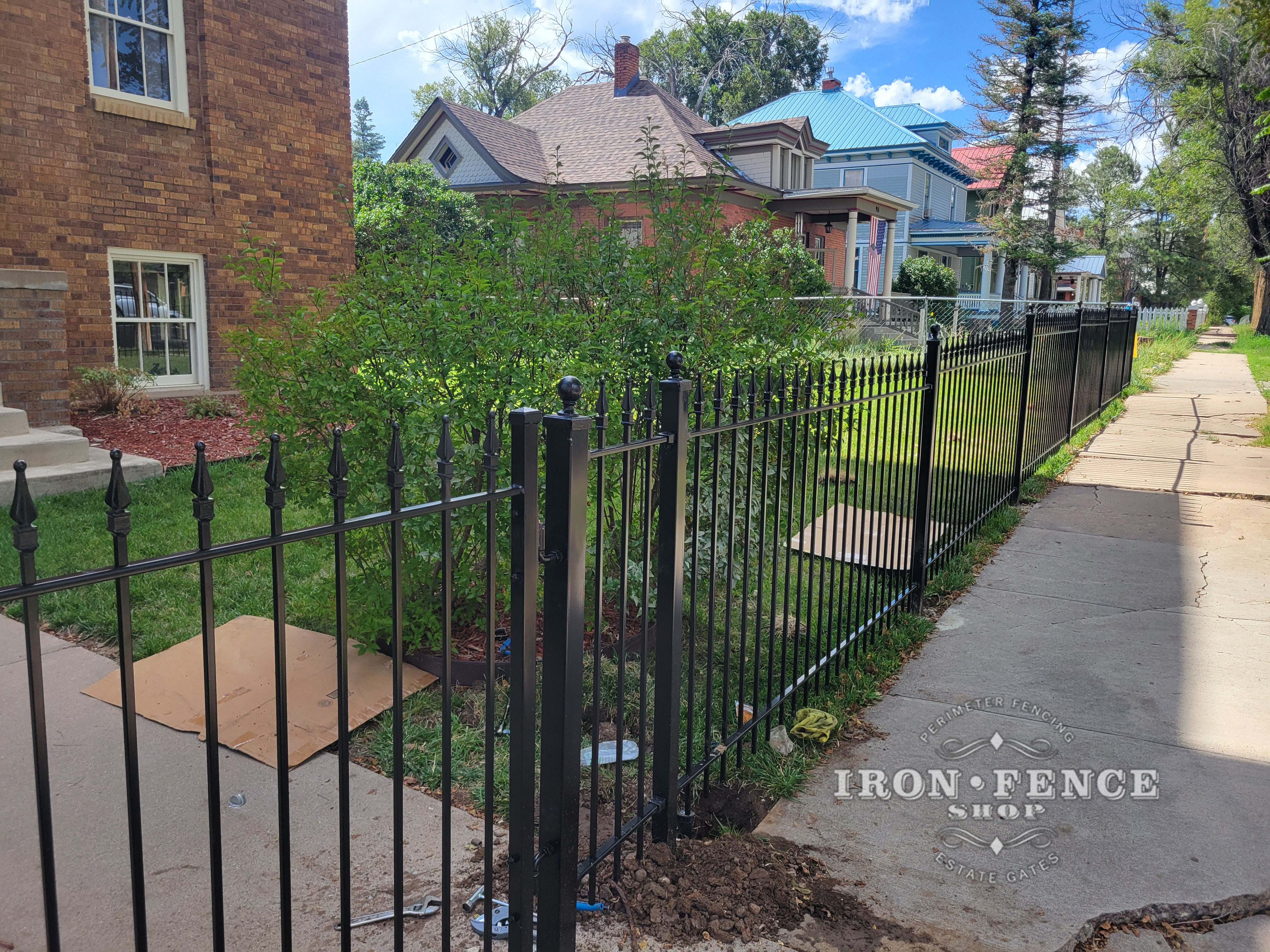4ft Tall Iron Fence Stair-Step Installation for Sloped Front Yard