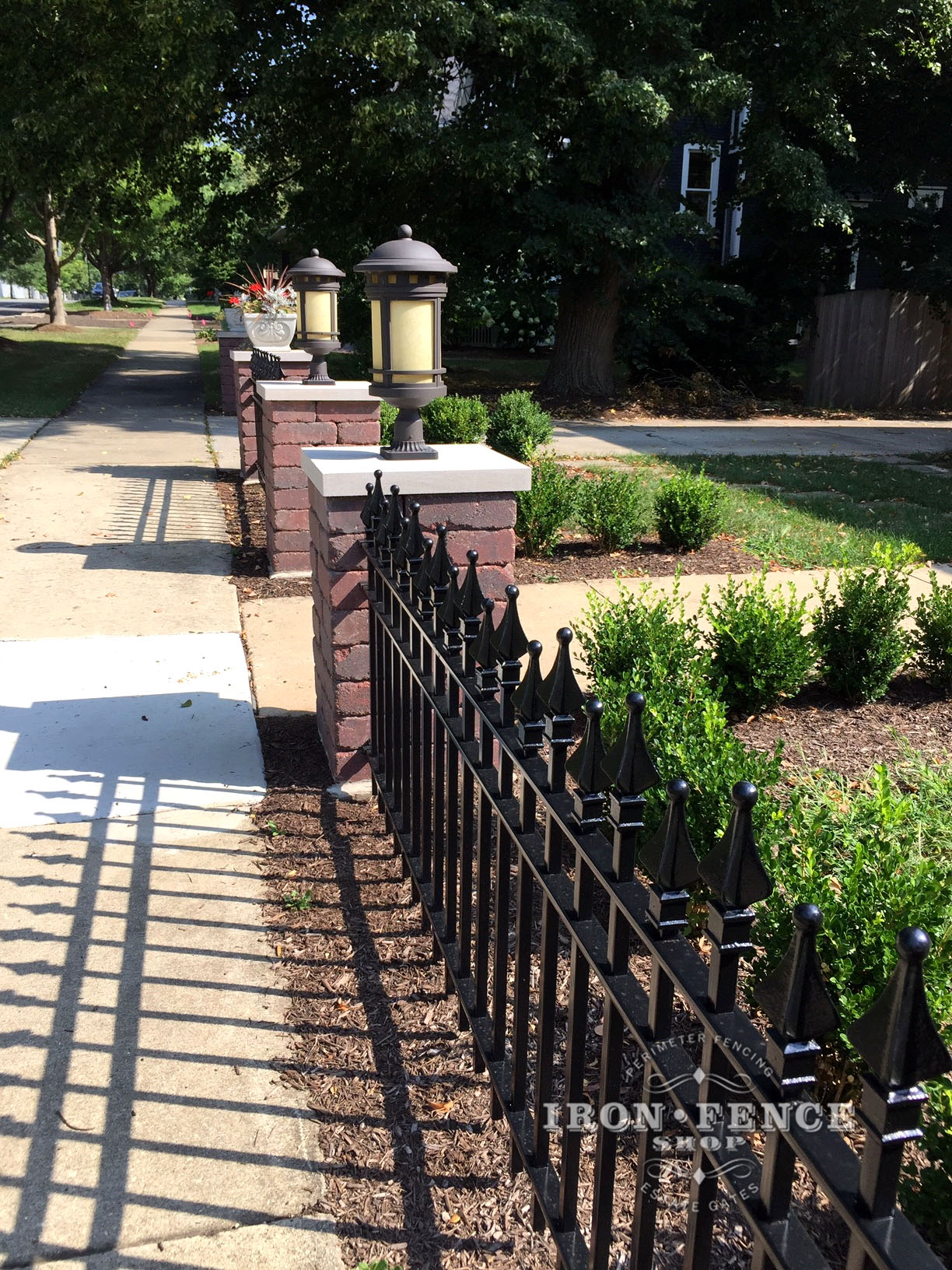 Signature Grade Stronghold Iron Fence in Custom Staggered Picket Style