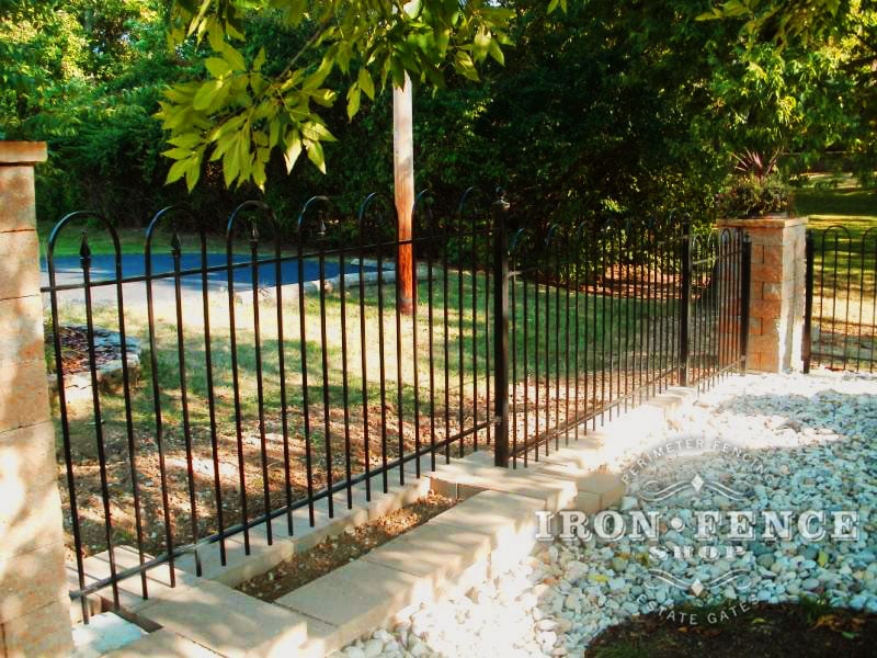 4ft tall iron hoop and picket fence stepped down a knee wall