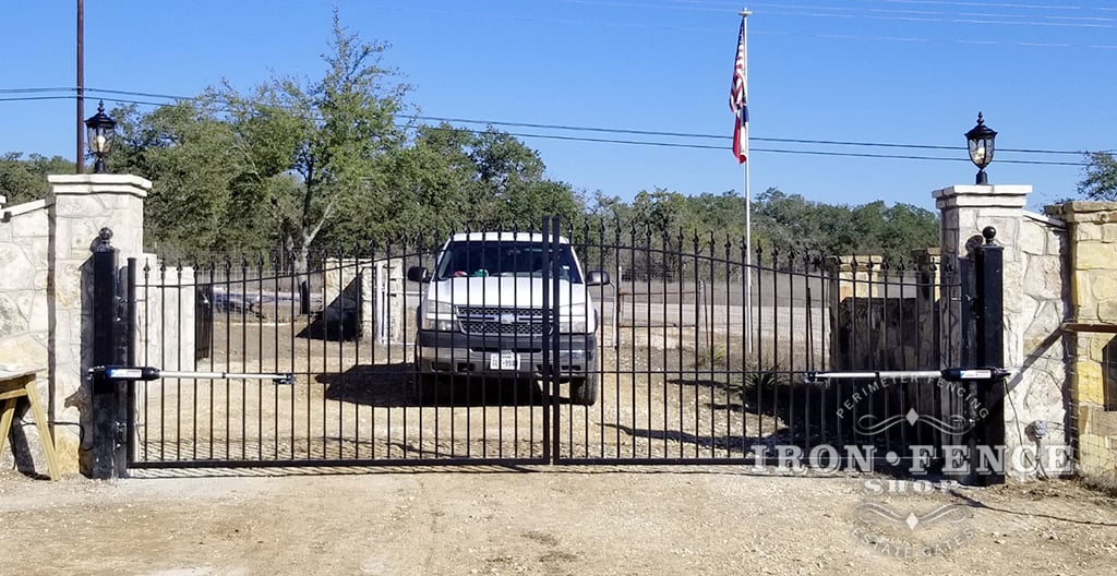 Wrought Iron Driveway Gate with Automation Mounted Behind Columns