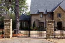12ft Wide Signature Grade Iron Driveway Gate with 6ft Arching to 7ft Profile - Mounted on Posts Behind Rock Columns (Style #1: Classic)