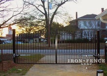 16ft wide arched iron driveway gate in a 6ft arching to 7ft height with decorative rings, puppy pickets and GTO openers (Style #16 - Rings Puppy Pickets)