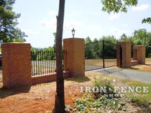 Wrought Iron Gate and Fence with Brick Entry Columns (16ft w x 6' Arching to 7' Gate with 5ft Tall Fence)