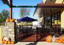 ft Tall Signature Grade Aluminum Fence and 4x5 Gate Installed with Masonry Pillars on a Commercial Business Patio