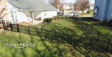 4ft Infinity Aluminum Fence Racked to Follow Grade in a Corner of a Yard Enclosure