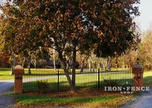 4 foot tall custom curved iron fence panel in center to compensate for grade (Based on Style #1 - Classic)