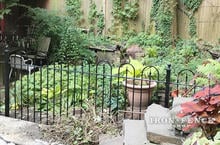 Our 4ft Tall Iron Fence in Hoop and Picket Style in a Garden Setting