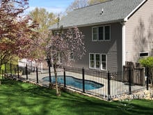 4ft Tall Classic Style Stronghold Iron Fence Stepped Down a Wall to Surround a Pool