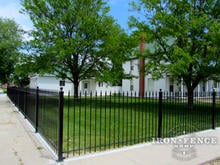 4ft Tall Traditional Grade Iron Fence Installed Along a Sidewalk Using Flange Posts (Style #1: Classic)