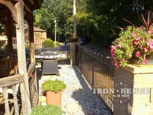 Side view of 4ft tall iron hoop and picket wrought fence 