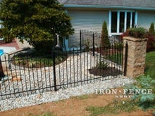 4ft tall wrought iron hoop and picket fence with stone corner column