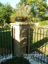 4ft tall iron hoop and picket style fence with corner stone pillar 