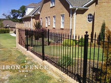 Our 4ft Tall Stronghold Iron Fence in Classic Style and Traditional Grade Stepped down a Brick Knee Wall with Flange Posts