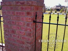 Our 4ft Tall Wrought Iron Fence Mounted to a Brick Column