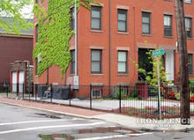 Wrought Iron Fence Installed Along a Corner City Lot (4ft Tall Classic Style in Traditional Grade)