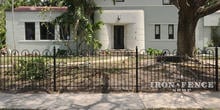 4ft Tall Iron Hoop and Picket Fence Along a Sidewalk