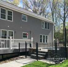 A 4ft Arched Iron Gate Entryway to the Back Patio and Pool