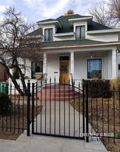 Our 4ft x 4ft Iron Arch Gate used to Complement a Front Walkway