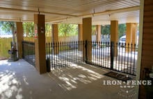 Wrought Iron Fence (4ft Tall in Signature Grade) with Customer Added Dog Barrier Bars at Bottom in Parking Area