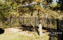 5ft Tall Aluminum Fence in Classic Style and Traditional Grade Curved Around a Backyard