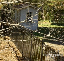 5ft Tall Aluminum Fence in Classic Style and Traditional Grade in a Backyard Setting