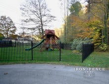 5ft Tall Wrought Iron Fence in Classic Style Surrounding a Play Area