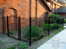 Wrought Iron Fence Used to Make a Garden Area (5ft Tall Traditional Grade Classic Fence and Arched Gate)
