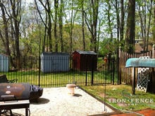 Wrought Iron Fence (5ft Tall Traditional Grade) and Arched Gate Used to Create a Patio Enclosure