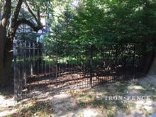 Our 5ft Tall Iron Fence in Traditional Grade on a Wooded Lot