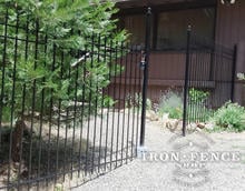 6 Foot Tall Traditional Grade Iron Fence Stair Stepped Down a Slope