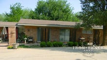 6ft Tall Traditional Grade Iron Fence Used in Conjunction with Brick Pillars to Create a Front Patio Area (Style #1: Classic)
