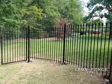 6ft Tall Signature Grade Classic Iron Fence Stair Step Installed to a Gate