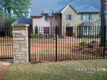 Wrought Iron Fence in Signature Grade (6ft Tall) with a Stone Colum