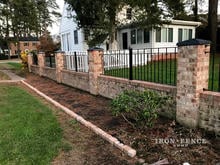 Custom Stronghold Iron Fence Height and Style Mounted on a Brick Wall
