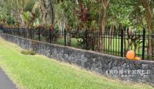 3ft Tall Infinity Aluminum Fence Mounted on a Stone Wall