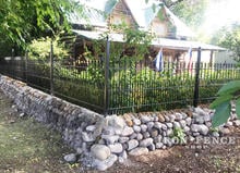 Custom Designed Wall Top Iron Fence with Puppy Pickets and Fleur De Lis