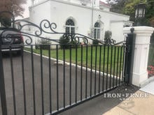 Custom Designed Stronghold Iron Driveway Gate with Scroll Work on Top