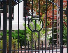 Custom iron walk gate with integrated "T" letter initial and puppy pickets (Style #15 - Puppy Picket Finials) 